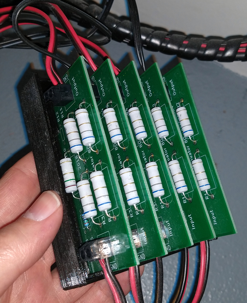 A simple resistive divider network to dampen the output of an audio amplifier 16db.