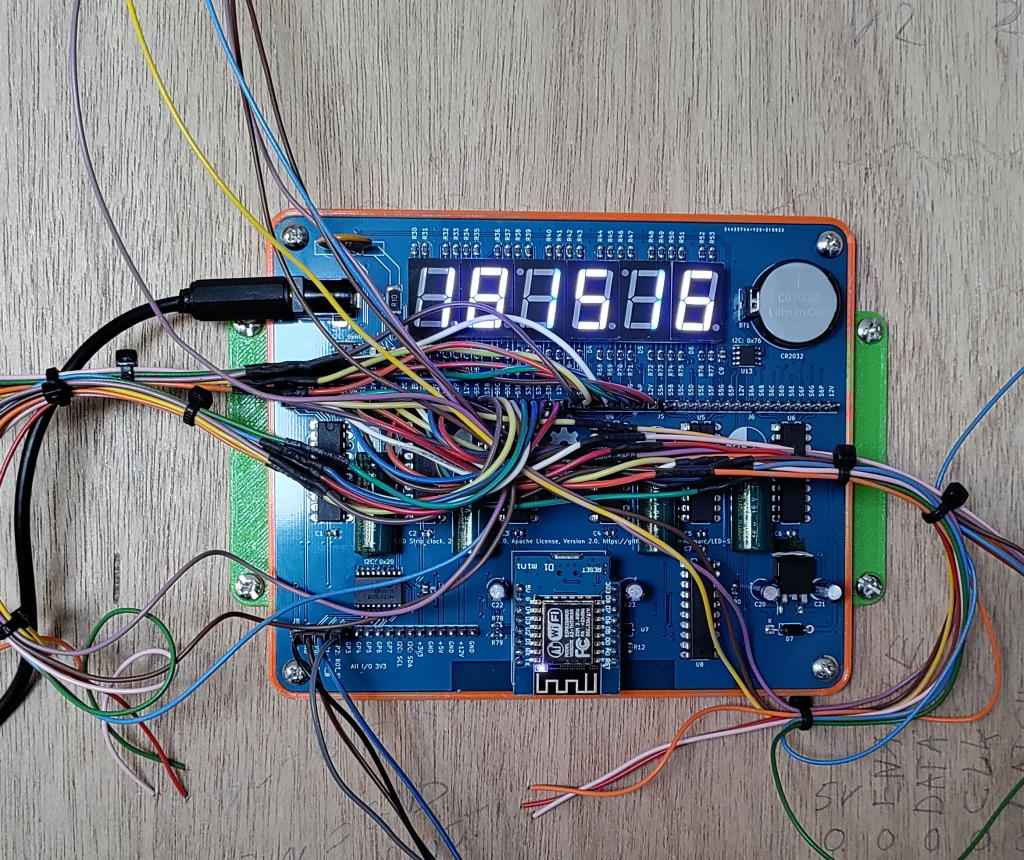 Just a ESP8266 with some power shift registers to drive LED strips and make a clock.
